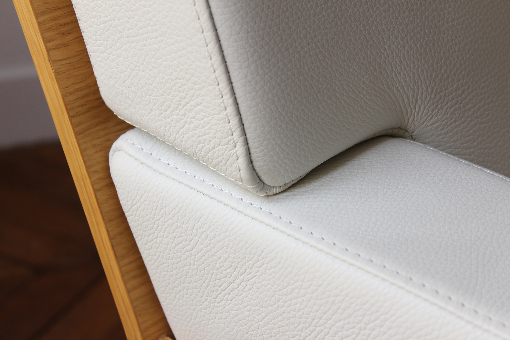 Designer armchair in leather, wood and metal Designer armchair in leather, wood and metal