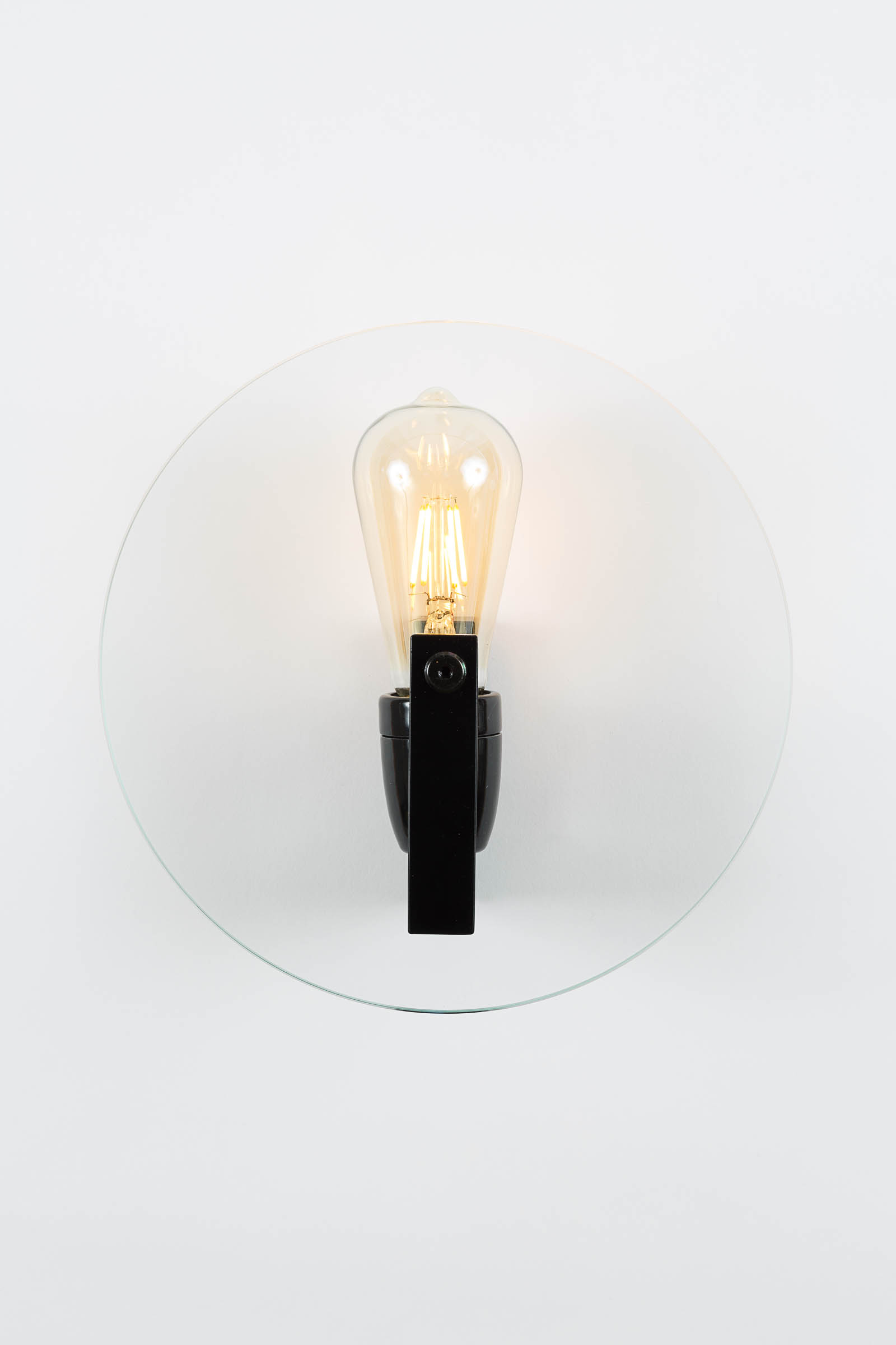 Designer wall-lamp in glass and mat black steel by Alex de Rouvray