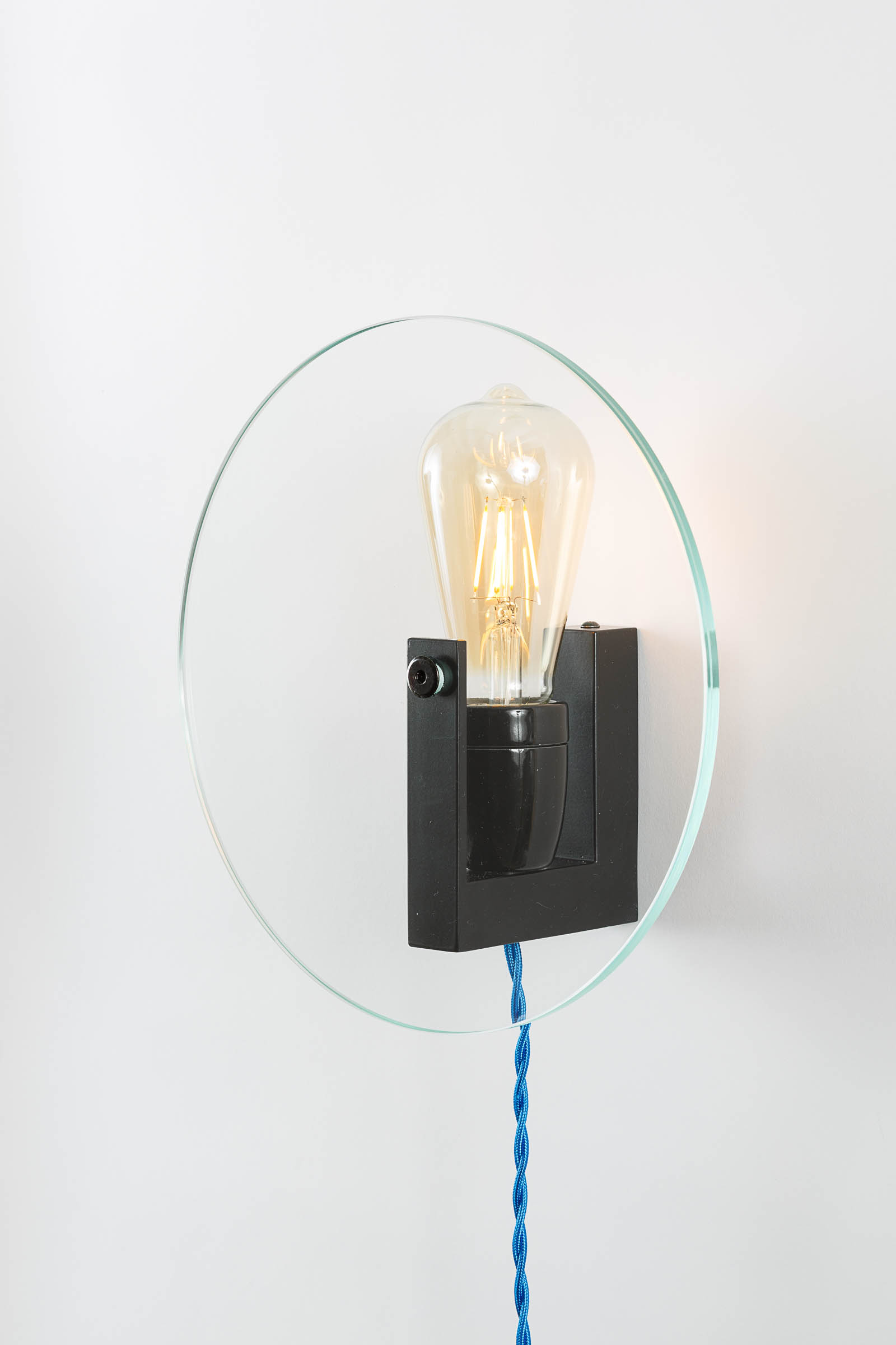 Designer wall-lamp in glass and mat black steel by Alex de Rouvray